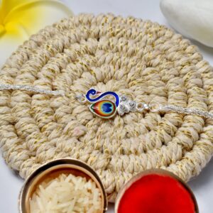 Elegant Silver Peacock Rakhi with Tricolor Enamel – Designer Rakhi for Brother