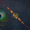 Krishna Name Rakhi with Decorative Beads and Stones