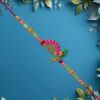 Mor Pankh Flute Rakhi with Pink Accents