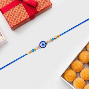 Stylish Blue Thread Rakhi with Central Stone, Pearl Beads, and Golden Detailing – Elegant Bracelet for Raksha Bandhan