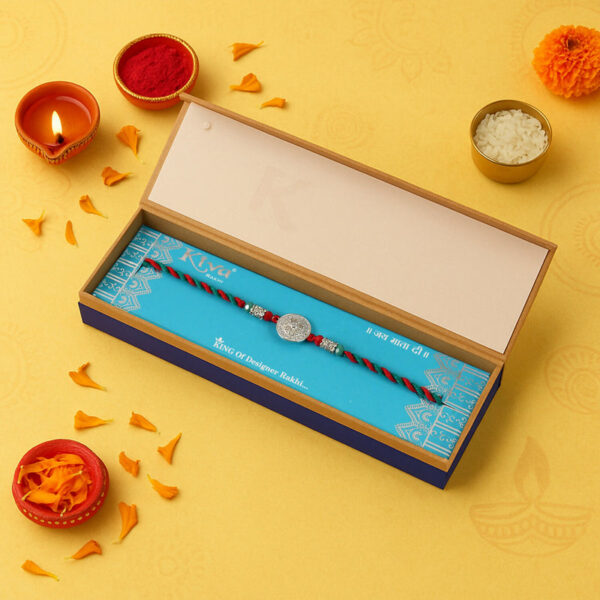 925 Silver Rakhi with Round Coin-Style Textured Motif on Red-Green Braided Thread – Premium Single Designer Rakhi